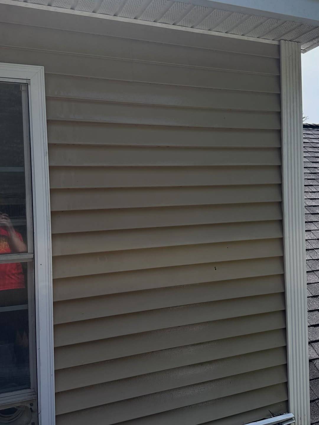 After: The same siding washed clean