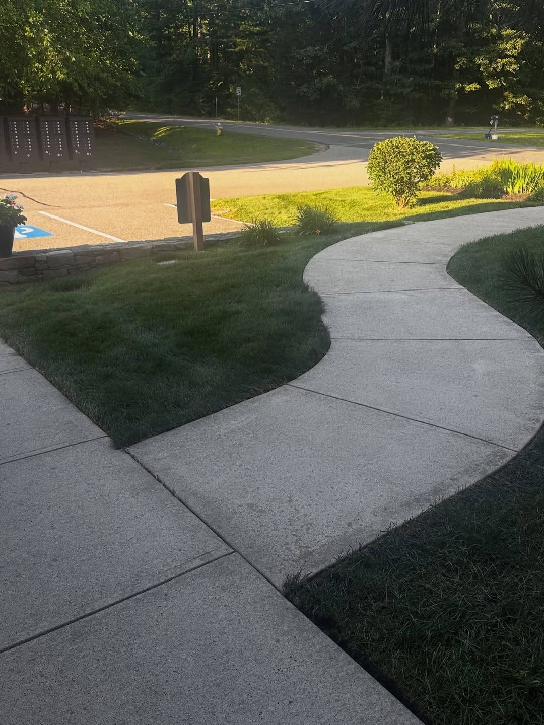 After: The same sidewalk after pressure washing
