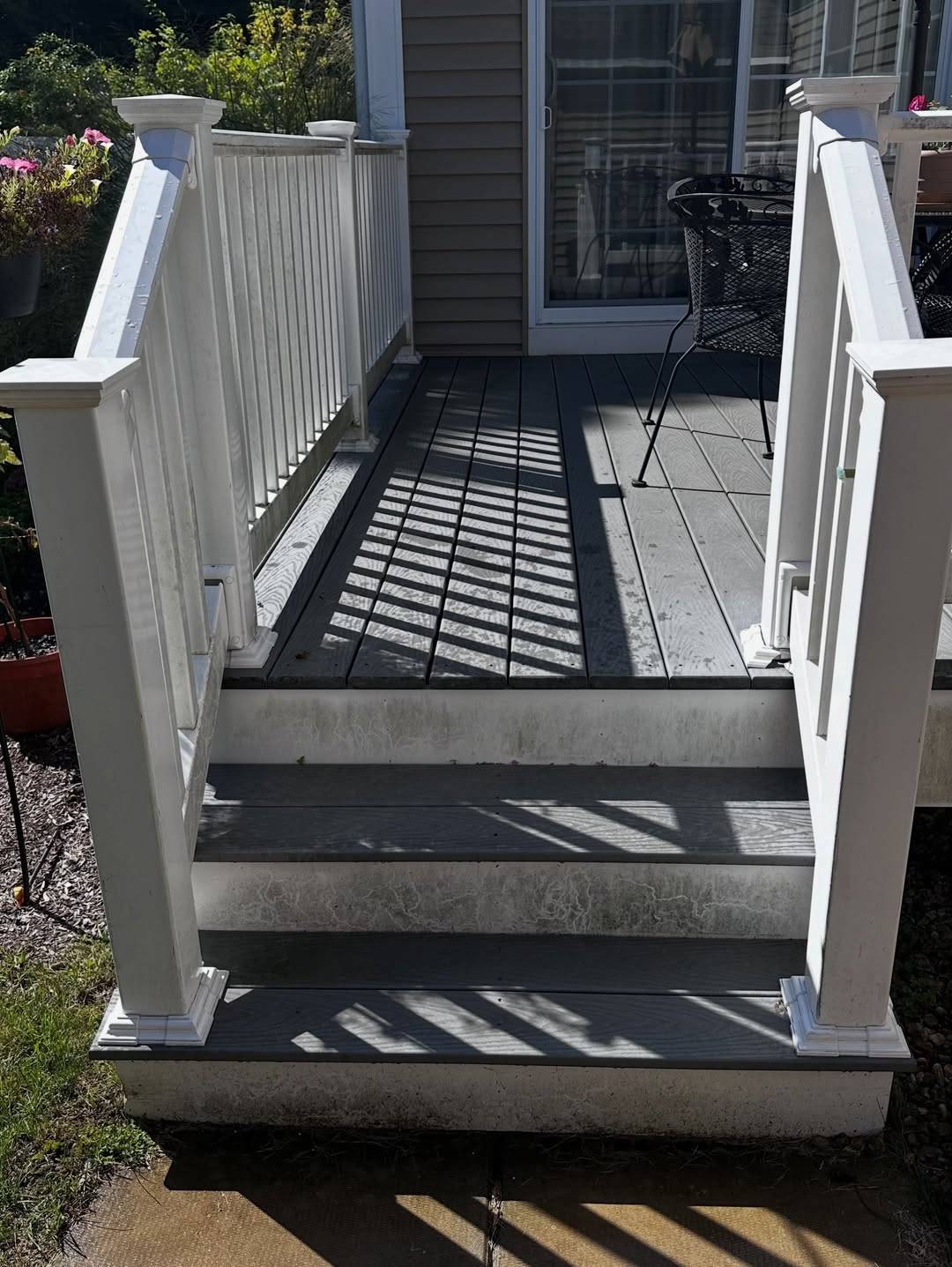 Before: Porch steps with dark staining