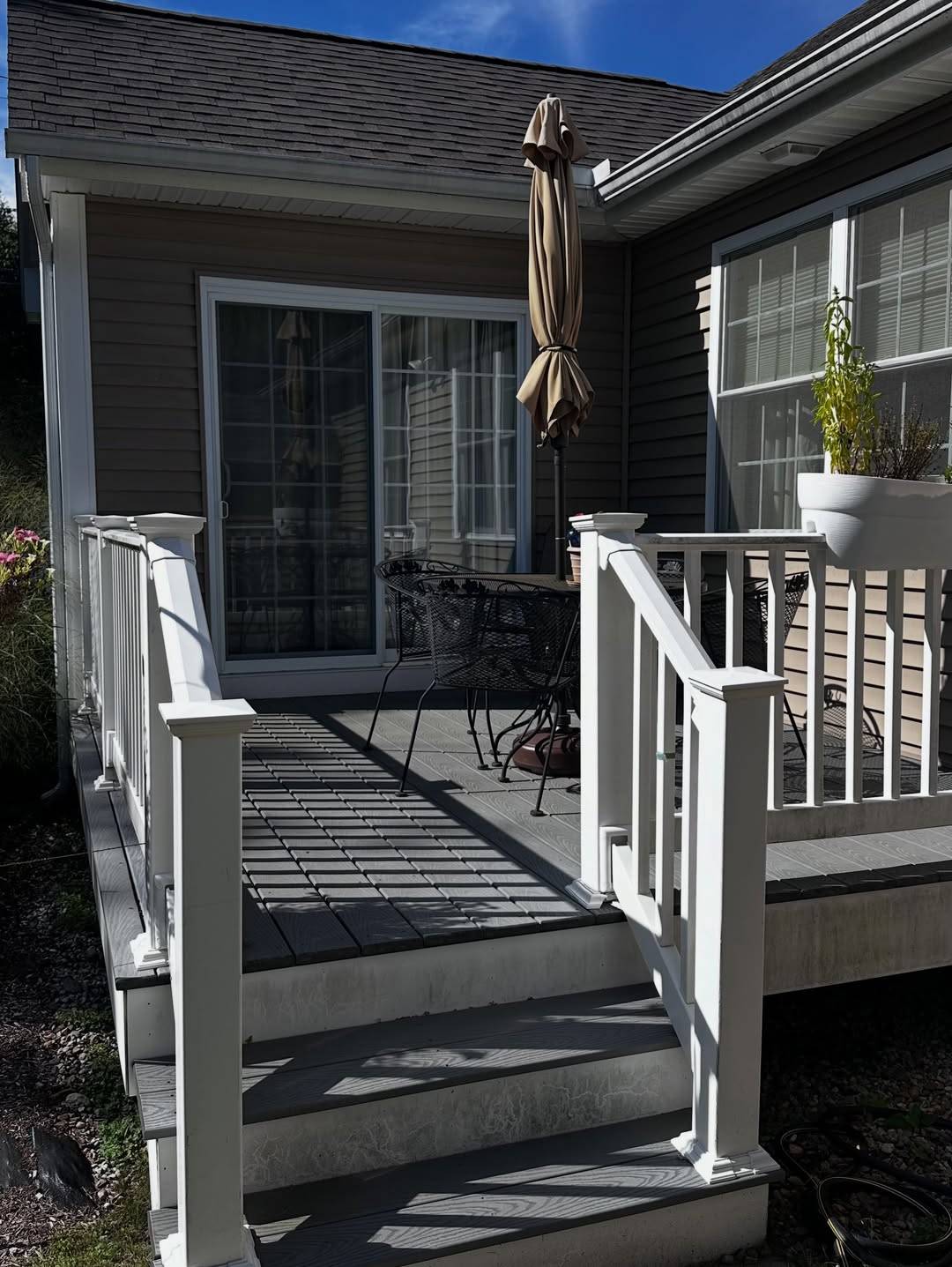 Before: A back deck with grimy steps and railings