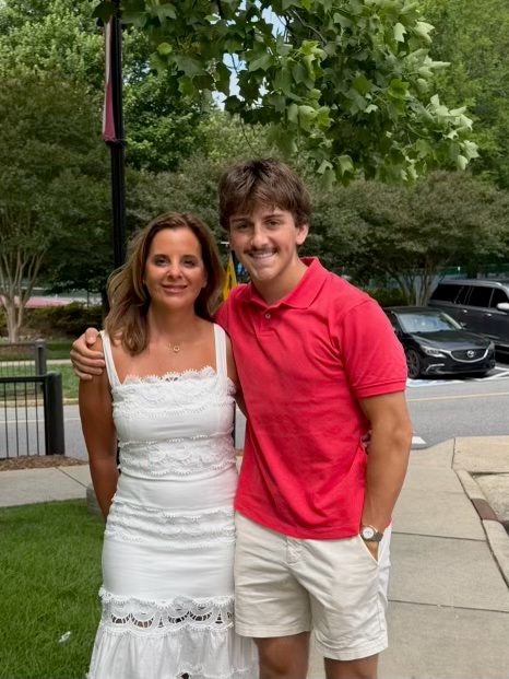 Aidan, founder of The Power Wash Pros, smiling outdoors in a red polo